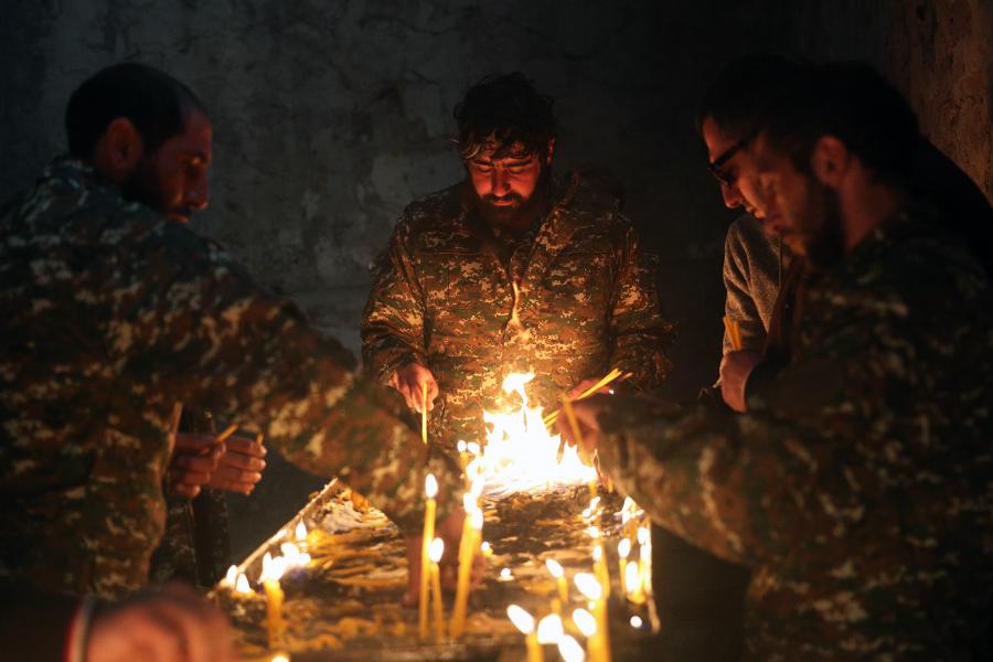 Armenian soldiers burning candles in farewell before Azerbaijan take over Karvachar region