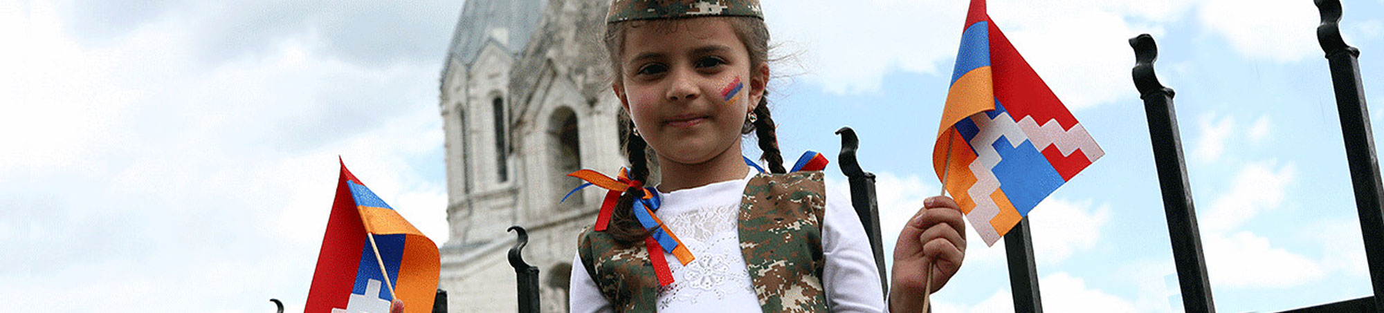 Armenian girl with Artsakh flags in Shushi. Artsakh (Nagorno Karabakh)