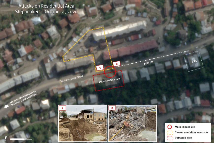 Satellite image recorded on October 8, 2020 shows an impact crater with a diameter of more than 10 meters along Sasountsi David Street in Stepanakert, only 150 meters north east of the ICRC office building. The strike severely damaged residential buildings located immediately in front of the crater.